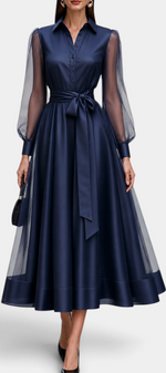 Mahaute Eirene midi shirt dress in navy satin with sheer long sleeves and a tied waist for a sophisticated look.