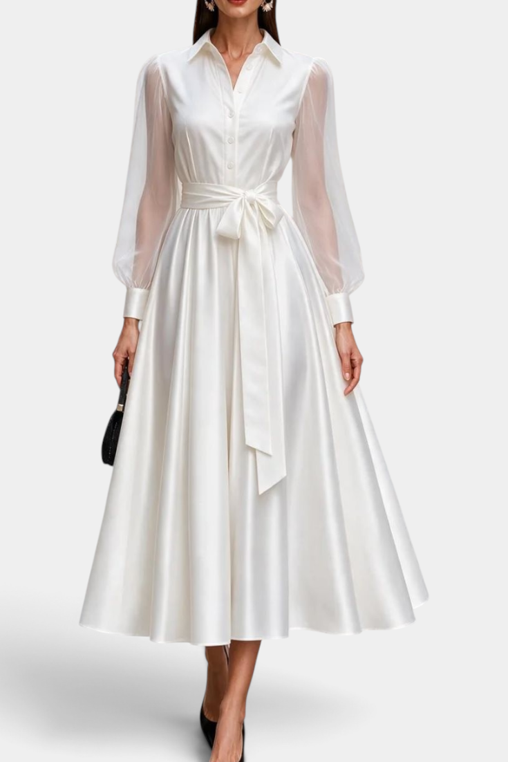 Mahaute Eirene midi shirt dress in white satin with sheer long sleeves and a tie waist for a formal event