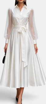 Mahaute Eirene midi shirt dress in white satin with sheer long sleeves and a tie waist for a formal event