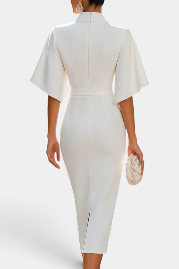 Mahaute Radoslava white midi dress with flared sleeves, cinched waist, and back slit, viewed from behind.