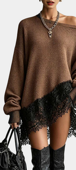 Mahaute oversized brown knit sweater dress with an off-the-shoulder neckline and black floral lace hem detail.