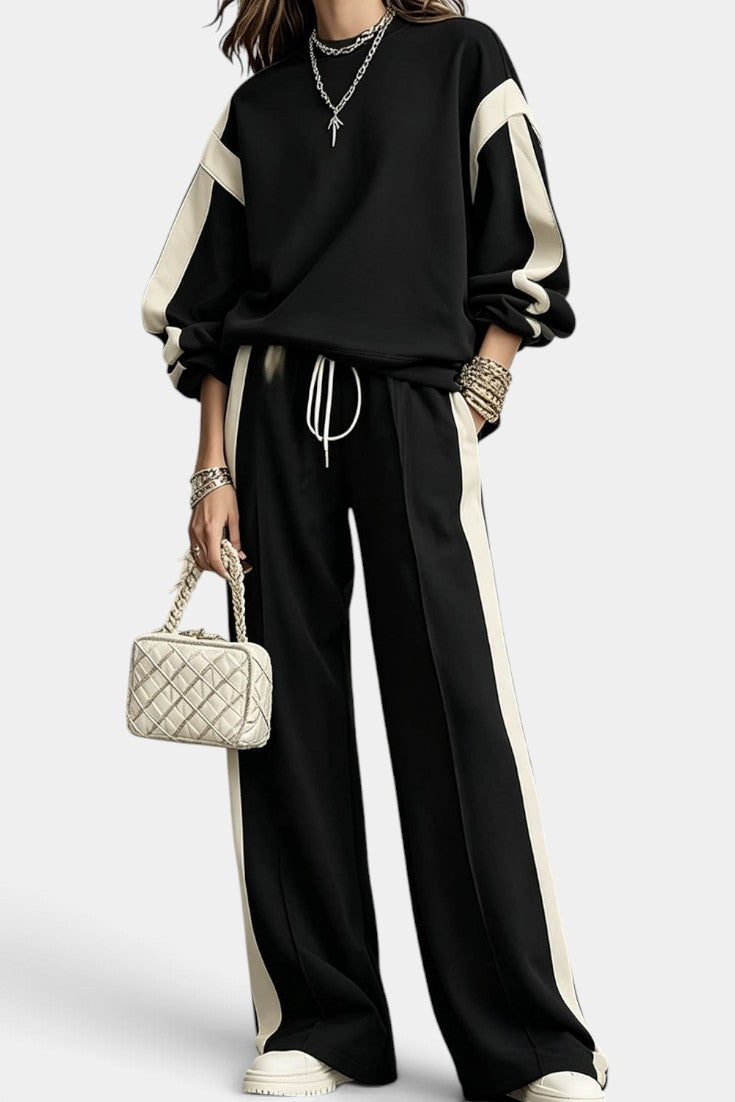 Ensemble deux pièces Mahaute Alix avec sweat et pantalon large à bandes contrastées, look décontracté et tendance.