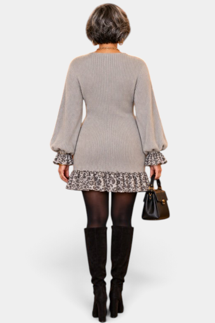 Mahaute Parven grey ribbed knit short dress with leopard print ruffled cuffs and hem, worn with black knee-high boots.