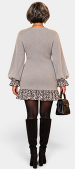 Mahaute Parven grey ribbed knit short dress with leopard print ruffled cuffs and hem, worn with black knee-high boots.