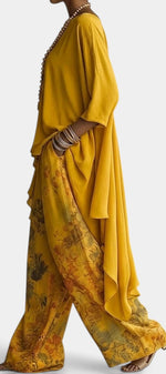 Ensemble deux pièces Mahaute, top asymétrique col rond et pantalon large à imprimé floral, style élégant et confortable.