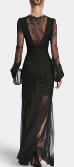 Mahaute Christabel black long lace evening gown with sheer floral sleeves, ruched bodice, and high slit, back view