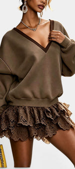 Mahaute Lilou short dress featuring an olive green oversized sweatshirt top with V-neck and ruffled lace skirt.