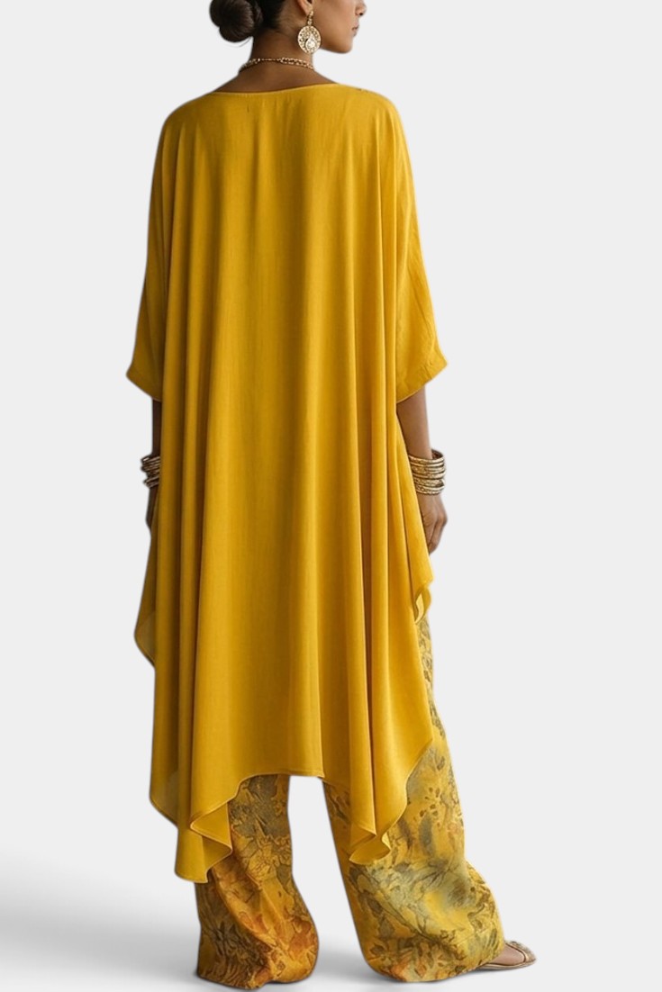 Ensemble deux pièces Mahaute avec top asymétrique col rond et pantalon large à imprimé floral, mode élégante et confortable.