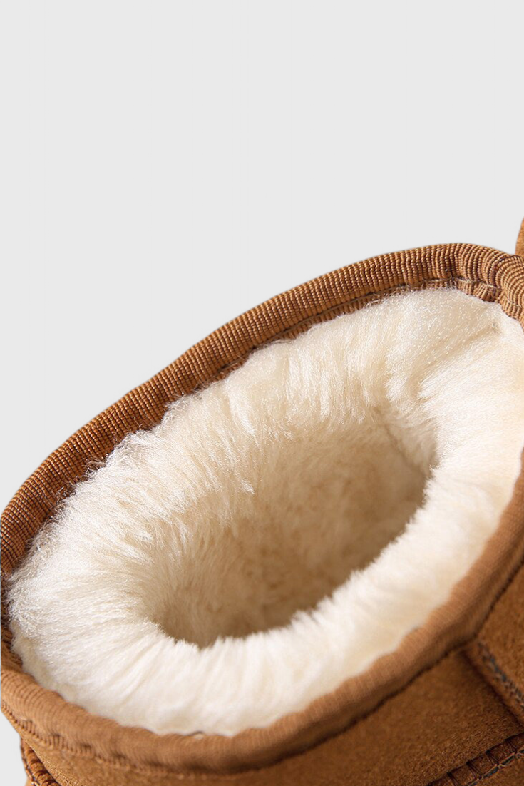 Bottines en cuir d’agneau Mahaute avec doublure shearling, intérieur en cuir, imperméables, style moderne et confortable.