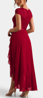 Mahaute Vittoria red asymmetrical long dress with floral lace bodice, V-neck and cascading ruffles.