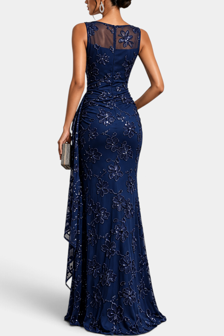 Mahaute Giuditta navy blue floor-length evening gown with floral sequins, sheer tulle neckline and asymmetric drape.