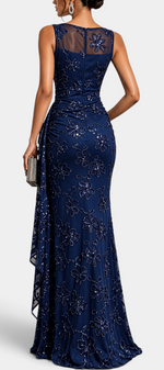 Mahaute Giuditta navy blue floor-length evening gown with floral sequins, sheer tulle neckline and asymmetric drape.