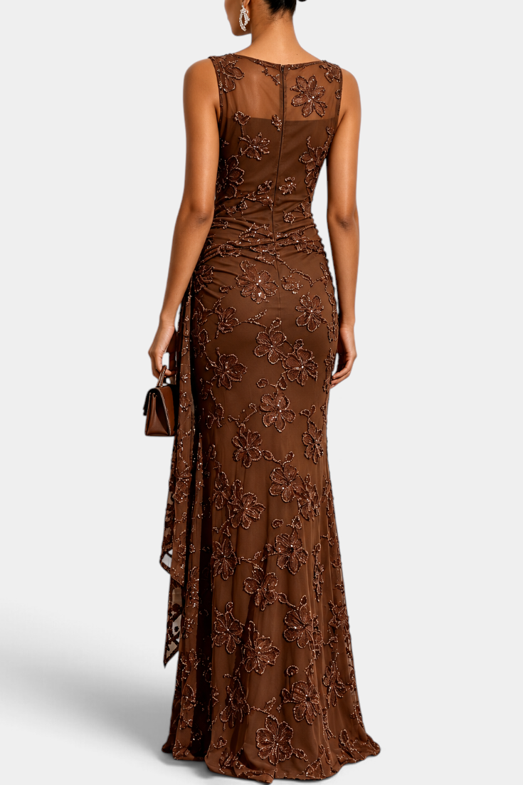 Mahaute Giuditta brown floor-length evening gown with floral sequins, sheer tulle neckline and asymmetric hip drape.
