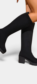 Mahaute Suny black knee-high boots with a chunky block heel and thick lug sole for a modern urban look.