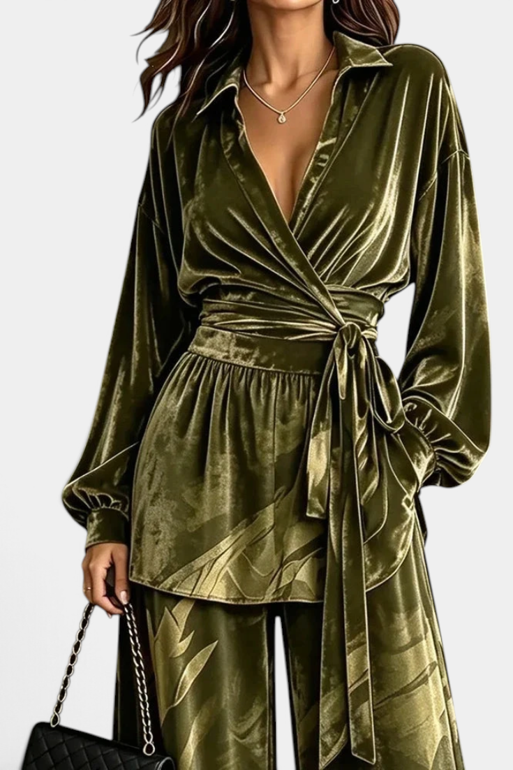 Mahaute Adeline olive green velvet wrap blouse with belted waist and matching wide-leg trousers with botanical print.
