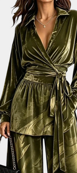 Mahaute Adeline olive green velvet wrap blouse with belted waist and matching wide-leg trousers with botanical print.