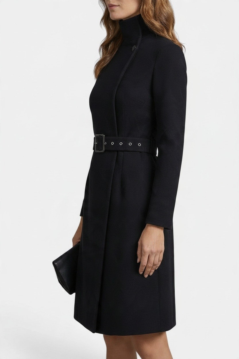 Mahaute Estée black midi wrap dress with high neck, long sleeves, and a matching buckled waist belt.