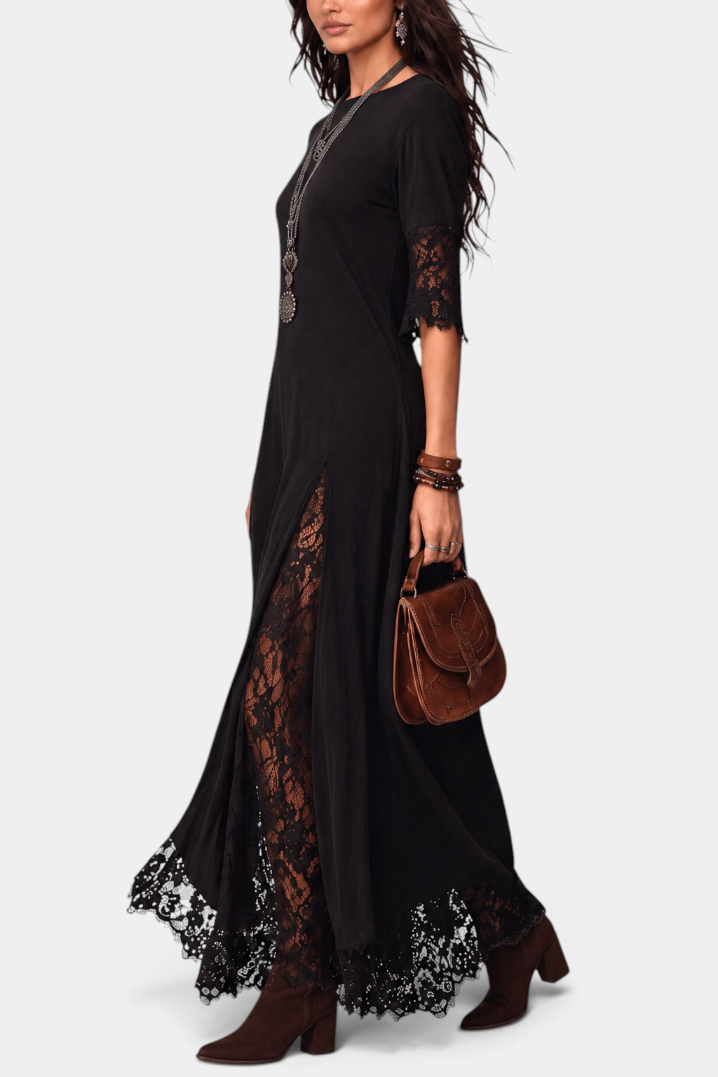 Mahaute Meliorine black maxi dress with floral lace inserts, mid-length lace sleeves, and a flowing silhouette.