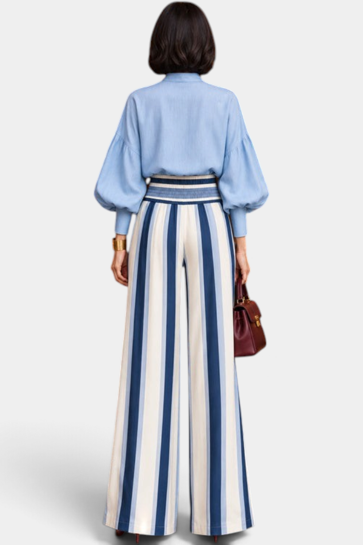 Mahaute Orlianne ensemble with light blue puff sleeve blouse and high-waisted wide-leg striped trousers, back view.