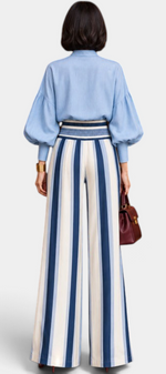 Mahaute Orlianne ensemble with light blue puff sleeve blouse and high-waisted wide-leg striped trousers, back view.