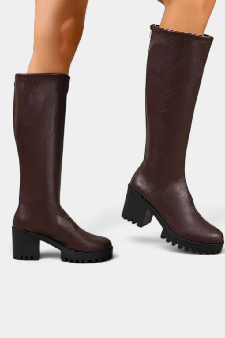 Mahaute Suny dark brown knee-high boots with a chunky block heel and thick lug sole for a modern urban look.