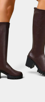 Mahaute Suny dark brown knee-high boots with a chunky block heel and thick lug sole for a modern urban look.
