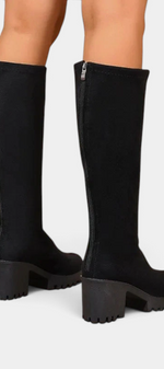Mahaute Suny black high-leg boots with a chunky block heel and lug sole, featuring a back zipper closure.
