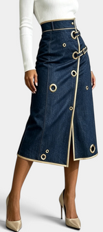 Mahaute Lyséa high-waisted dark denim midi skirt with gold eyelets, buckle straps, and a front slit.