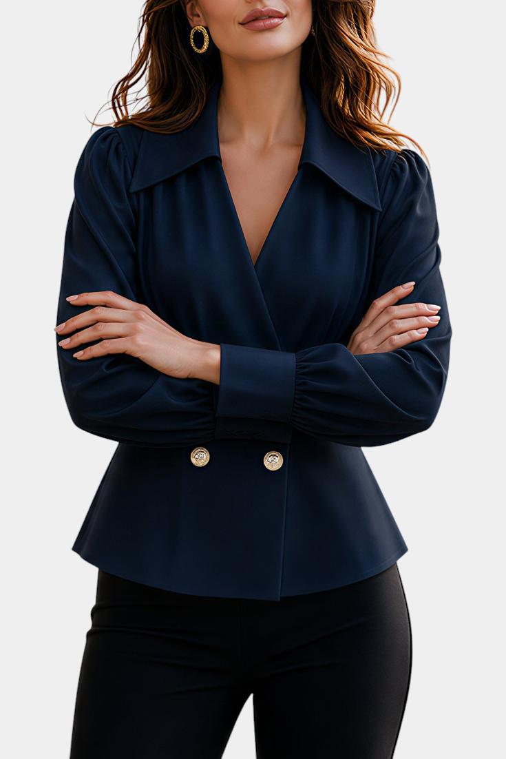 Mahaute navy blue tailored blouse with crossover neckline, gold buttons, and long puff sleeves.