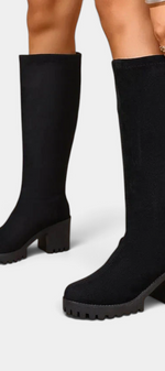 Mahaute Suny black knee-high boots with a chunky block heel and thick lug sole for a modern urban look.