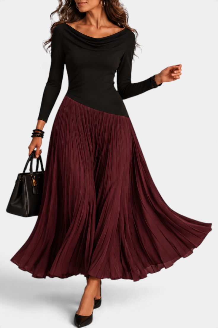 Mahaute Adelajda long black and burgundy pleated dress with draped neckline and asymmetrical waist on a model