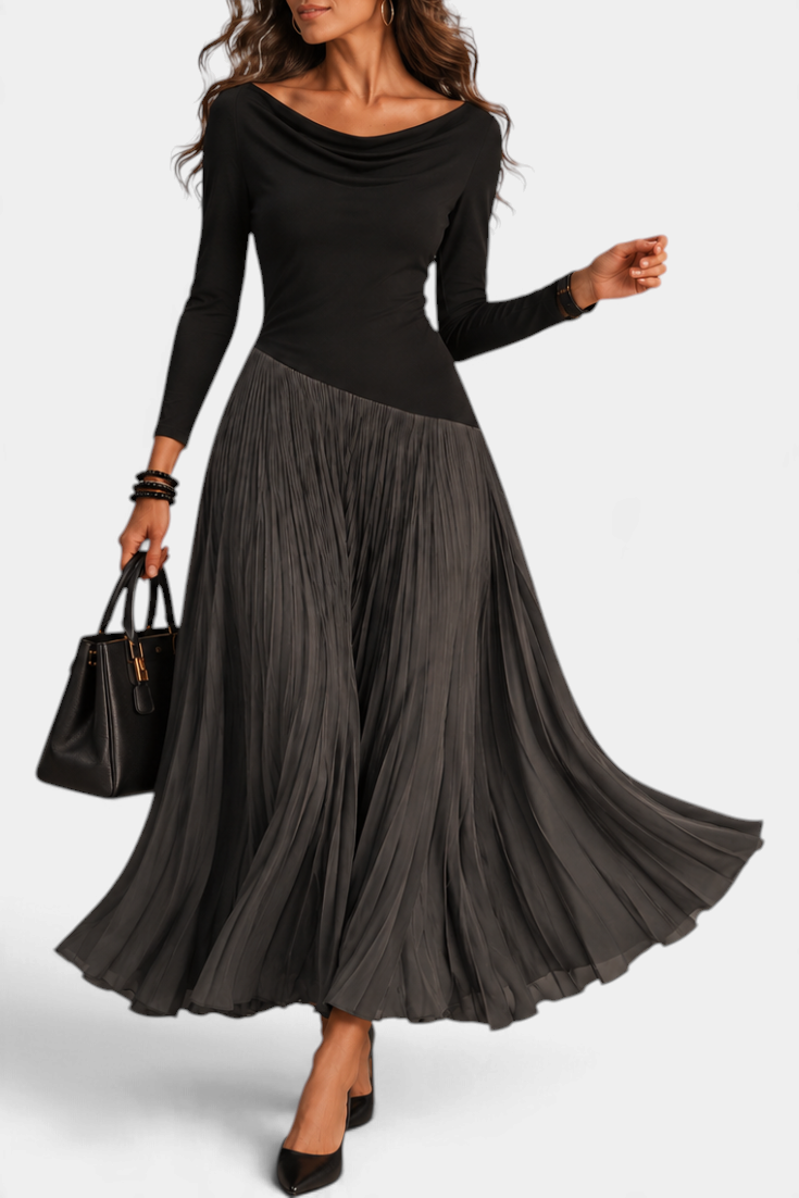 Mahaute Adelajda long black dress with a draped neckline, long sleeves, and an asymmetrical pleated skirt.