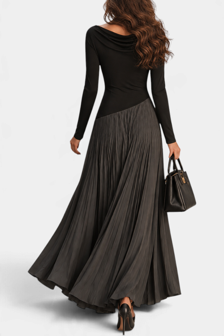 Mahaute Adelajda long black pleated dress with draped neckline and asymmetrical waist, back view on a model.