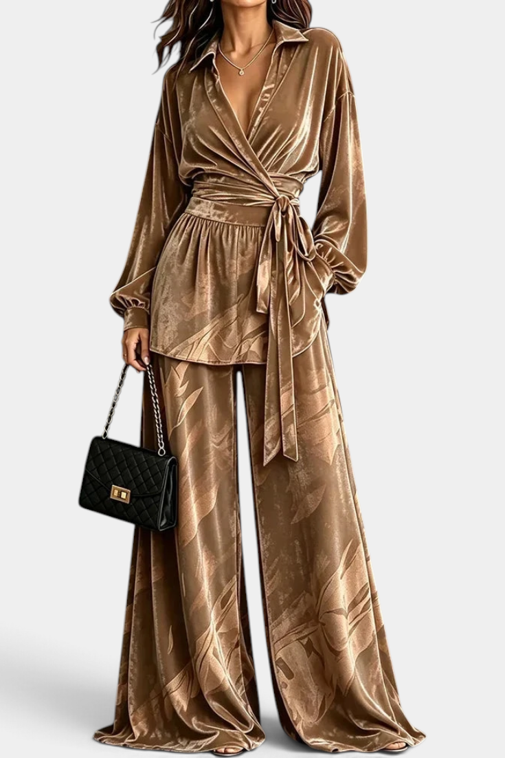 Mahaute Adeline velvet wrap blouse and wide-leg trousers set in bronze with botanical print and belted waist.