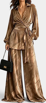 Mahaute Adeline velvet wrap blouse and wide-leg trousers set in bronze with botanical print and belted waist.