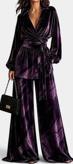 Mahaute Adeline purple velvet wrap blouse and wide-leg trousers set with botanical print and belted waist.