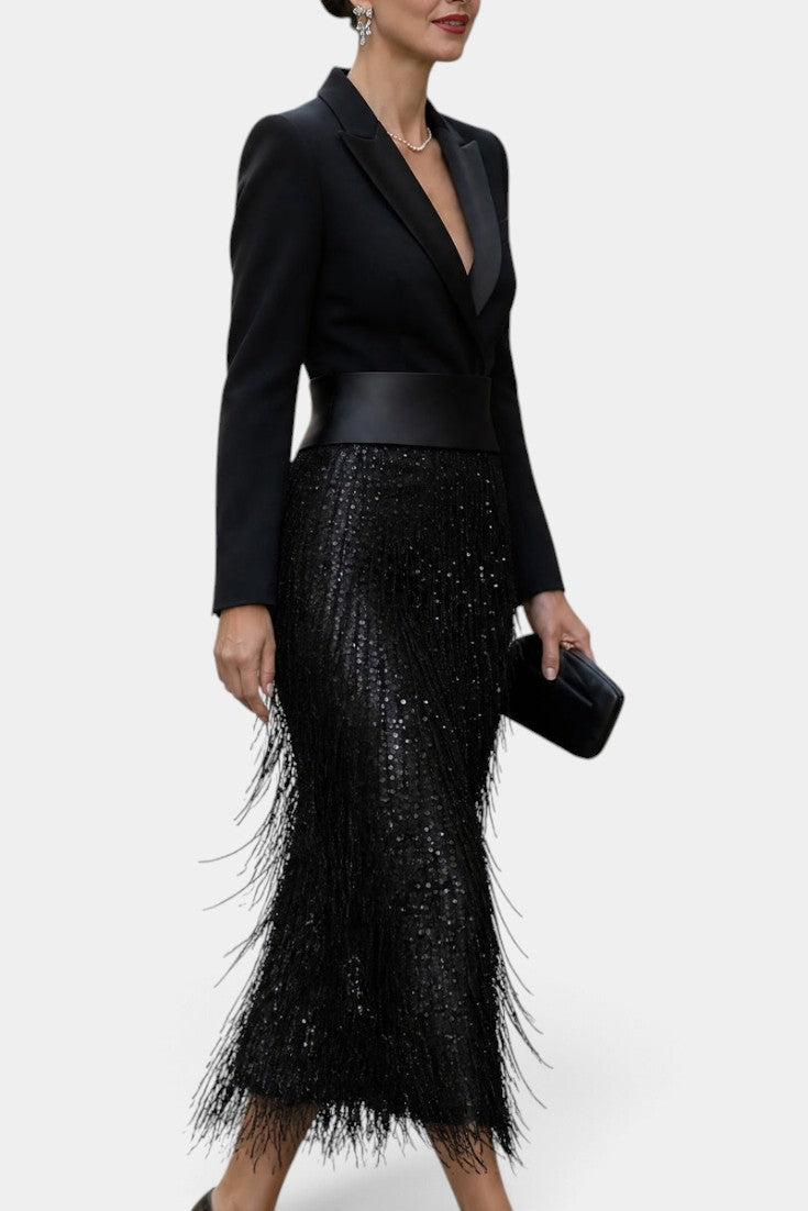 Mahaute Adrienne black midi blazer dress with a satin waist belt, sequined skirt, and long fringe detailing.