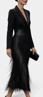 Mahaute Adrienne black midi blazer dress with a satin waist belt, sequined skirt, and long fringe detailing.