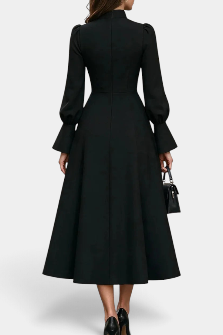 Back view of Mahaute Albena black midi dress featuring a high gathered collar, puff sleeves, and a flared skirt.