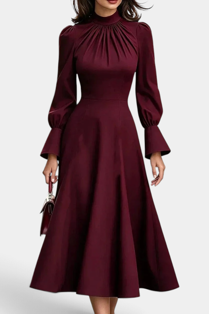 Mahaute Albena midi dress in burgundy with a gathered high neck, puffed sleeves, and a flared skirt.