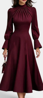 Mahaute Albena midi dress in burgundy with a gathered high neck, puffed sleeves, and a flared skirt.