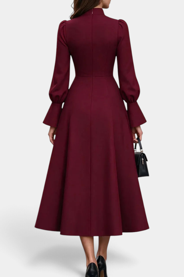 Back view of Mahaute Albena midi dress in burgundy with high ruffled collar, puffed sleeves, and flared skirt.