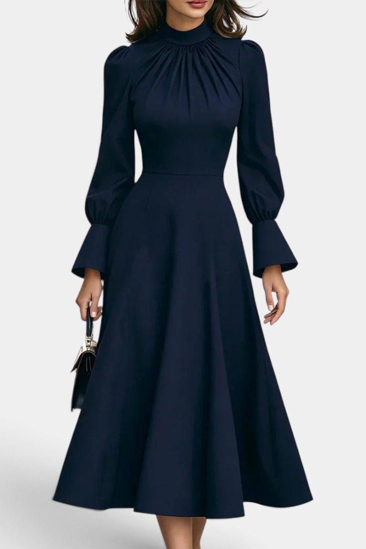 Mahaute Albena navy midi dress with a gathered high neck, cinched waist, and elegant puffed sleeves.