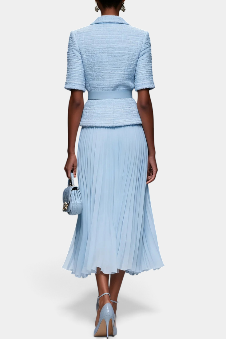 Back view of Mahaute Amabel light blue textured short-sleeve belted blazer and pleated midi skirt ensemble