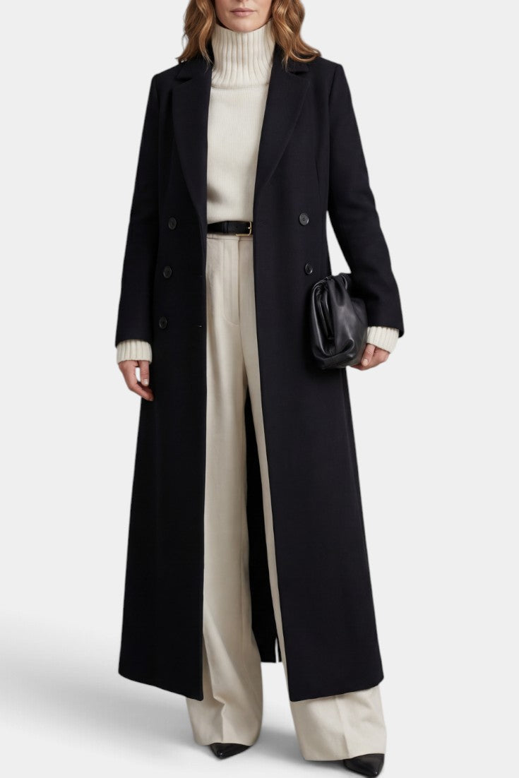 Manteau long noir Mahaute Amalberge avec double boutonnage et col tailleur, élégant et sophistiqué.