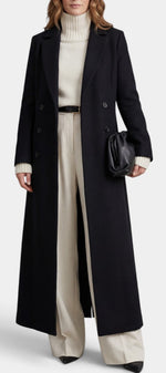 Manteau long noir Mahaute Amalberge avec double boutonnage et col tailleur, élégant et sophistiqué.