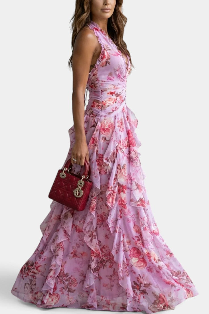 Robe longue fleurie Mahaute Amaya avec dos nu, volants cascade et style élégant, parfaite pour une occasion spéciale.