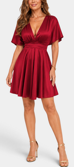 Mahaute Ambre short red satin dress with V-neck, cinched waist, and flared skirt for elegant occasions.