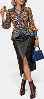 Mahaute Ashlee leopard print blouse with contrasting denim collar and cuffs, worn with a black leather midi skirt.