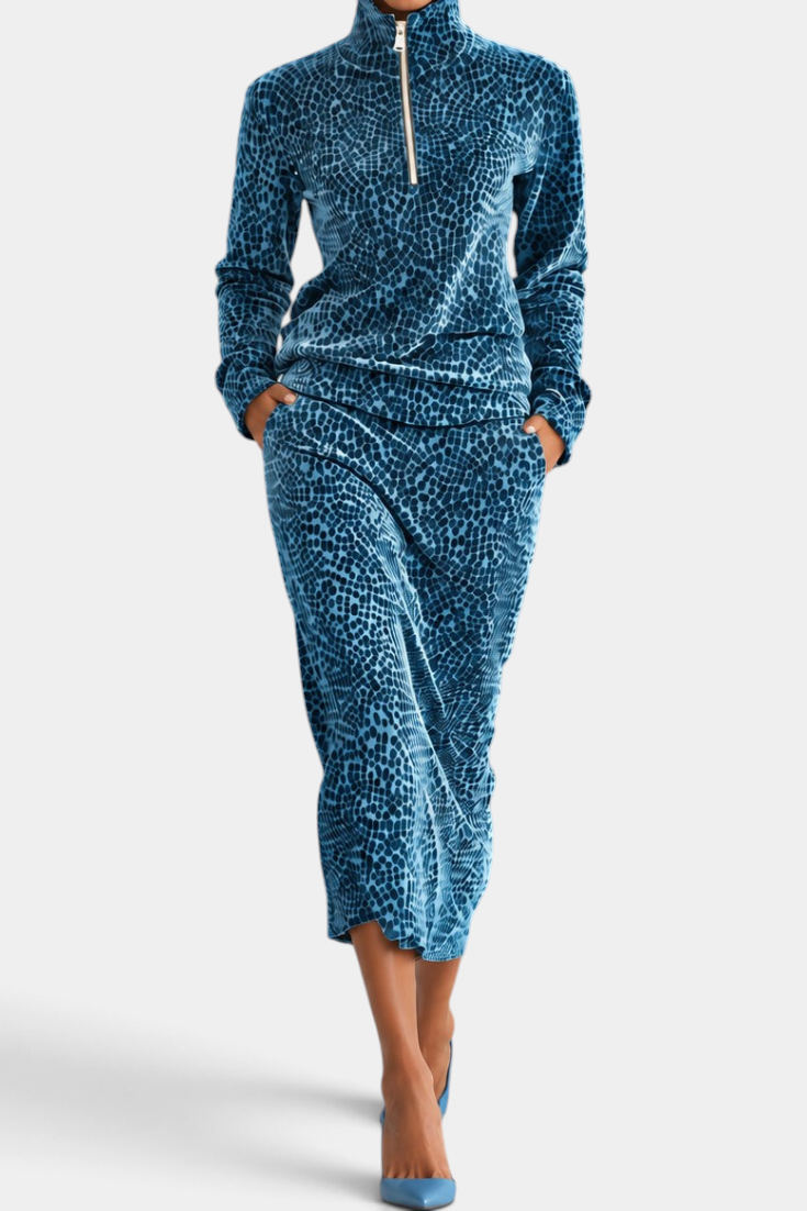 Mahaute Avdotya blue animal print velvet matching set with a zip-up mock neck top and midi skirt.